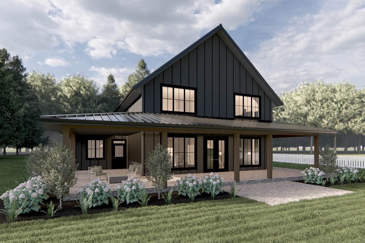 New American barndominium house plan 485008DUG with front and side wraparound porch, 2-car garage, and a two-story living room.