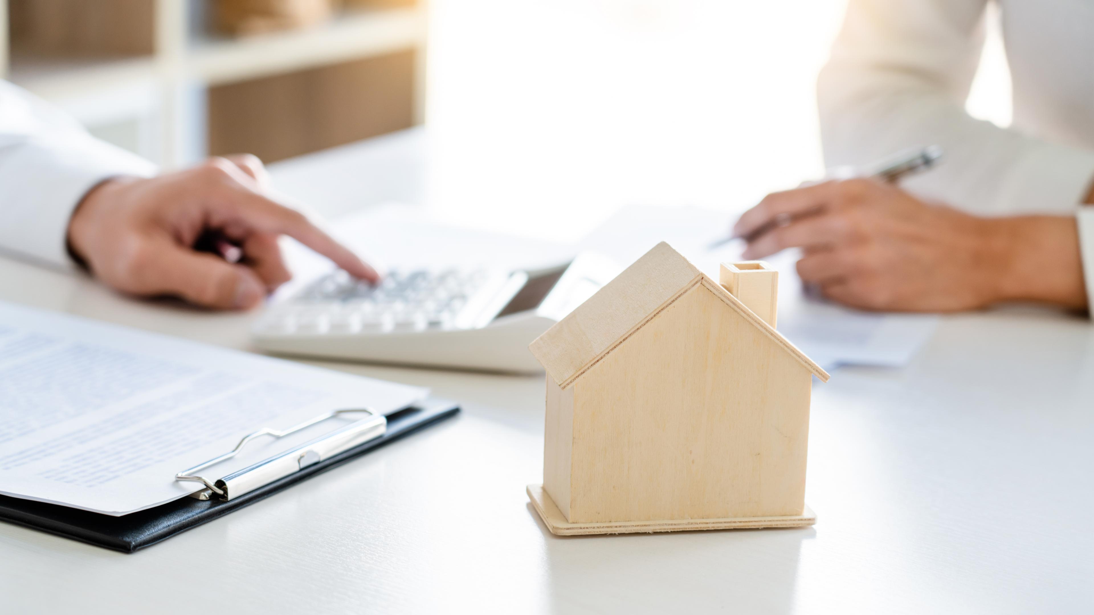 Real Estate Agent broker or House developer showing contract for buying house agreement to consultant employee.