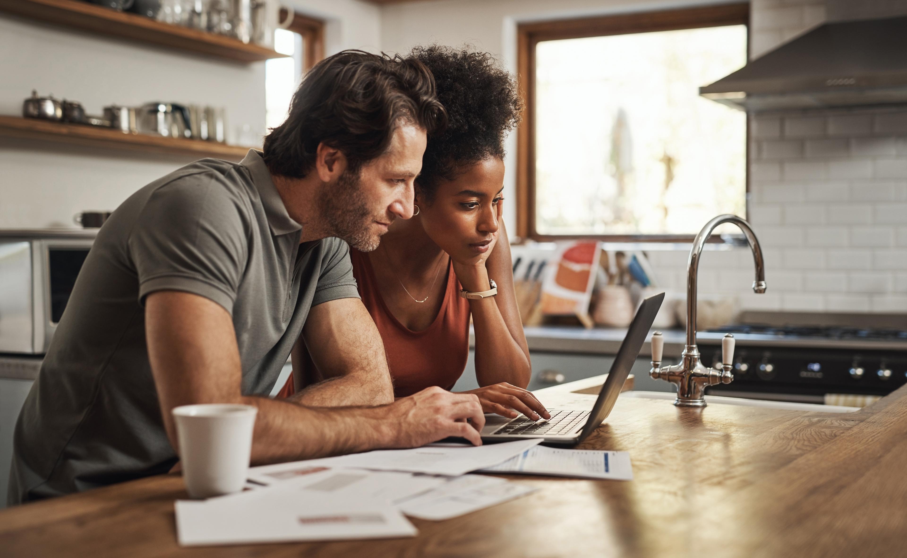 Couple Browsing Stock House Plans
